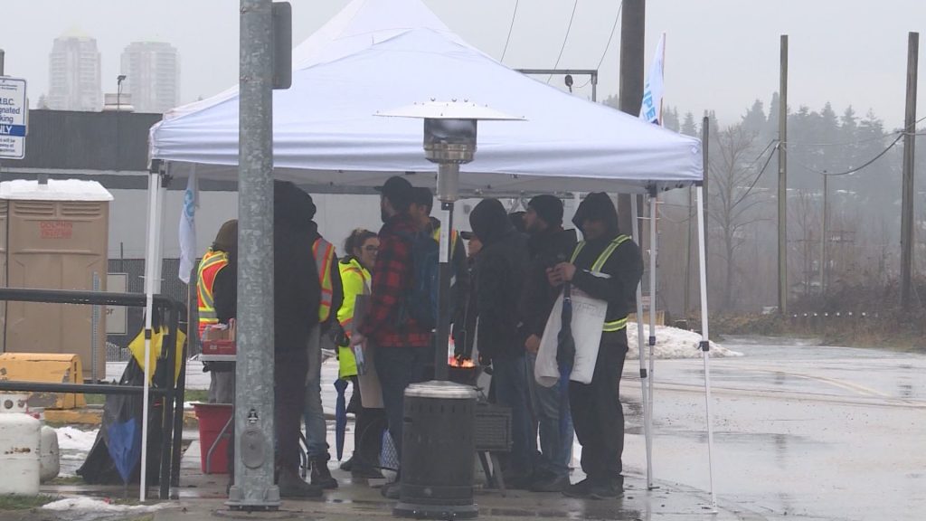 CUPE 4500 members with signs at a picket line after a 48-hour strike, halting bus and SeaBus services, began the morning of Monday, Jan. 22, 2024.