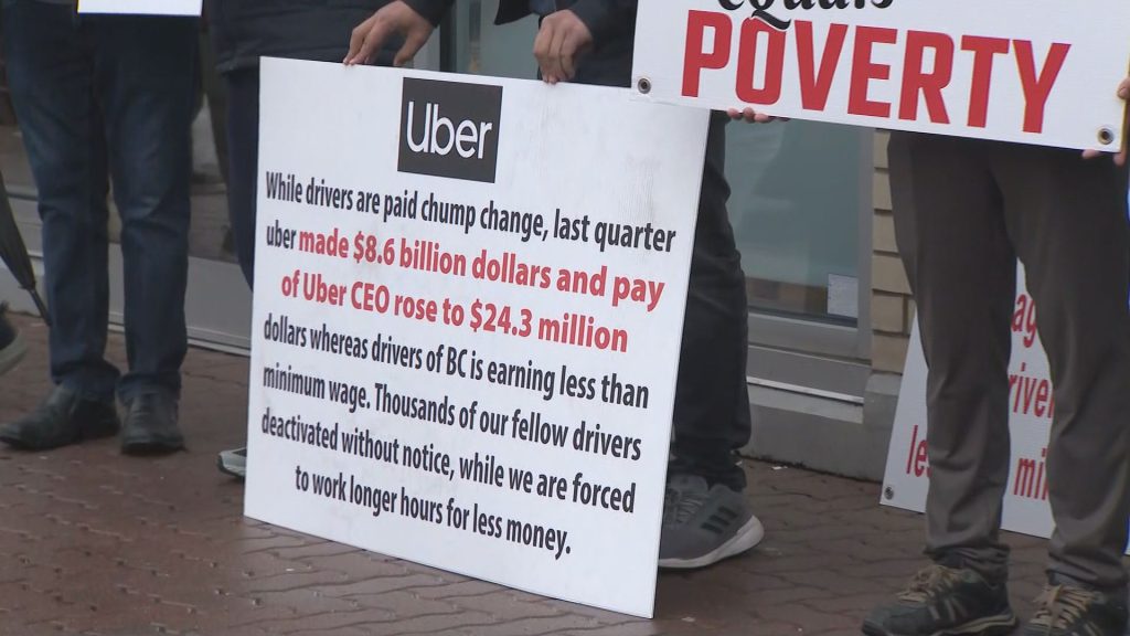 Uber and Lyft drivers protest outside of B.C. Labour Minister Harry Bains office on Tuesday January 24, 2024