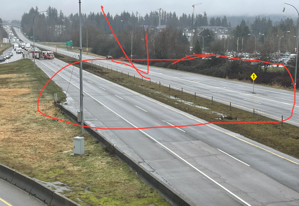 A photo showing a power line down across Highway 99 in south Surrey on Thursday, Jan. 25, 2024