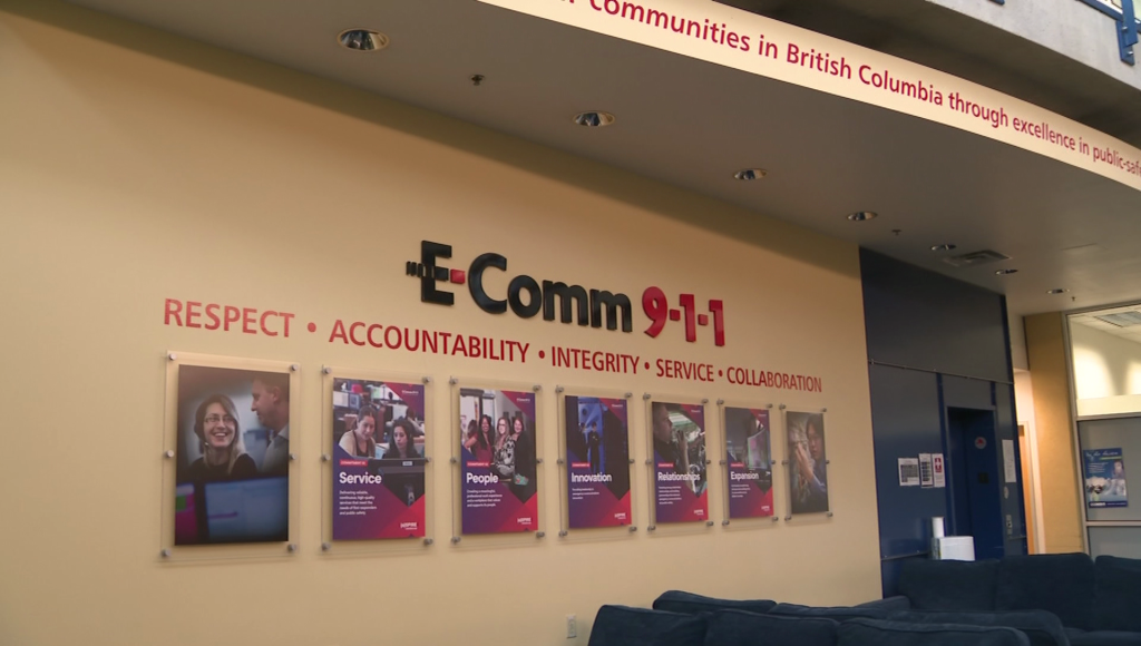 E-Comm 9-1-1 office pictured with a sign that says respect, accountability, integrity, service, and collaboration on the wall.