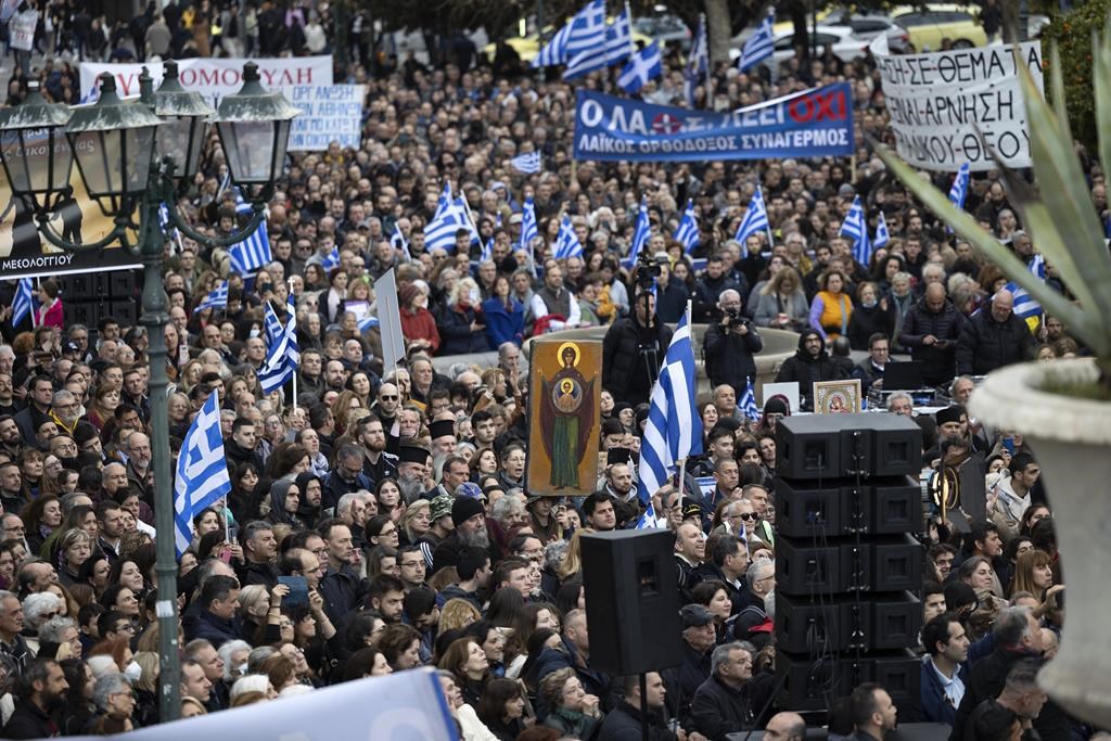 Protesters gather during a rally against same-sex marriage, at central Syntagma square, in Athens, Greece, Sunday, Feb. 11, 2024.