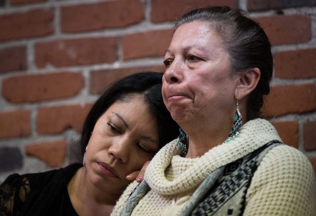 Lorelei Williams, left, rests her head on Michelle Pineault's shoulder as they listen during a Coalition on Missing and Murdered Indigenous Women and Girls news conference, in Vancouver, B.C., on Monday April 3, 2017. The coalition of family members and more than 35 advocacy and support organizations voiced concerns about the roll out of the National Inquiry on Missing and Murdered Indigenous Women and Girls. The remains of Pineault's daughter Stephanie Lane, were found on serial killer Robert Pickton's farm. THE CANADIAN PRESS/Darryl Dyck