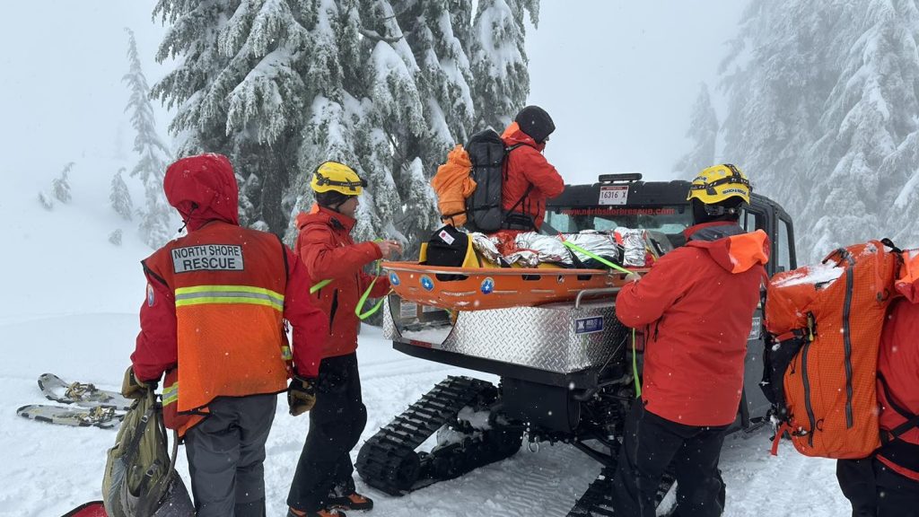 North Shore Rescue crews perform a rescue near the face of Pump Peak near Mount Seymour