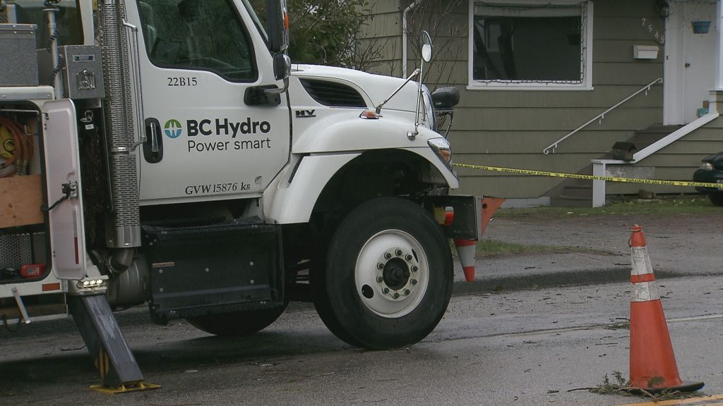 BC Hydro crews clean up a downed tree across a power line.