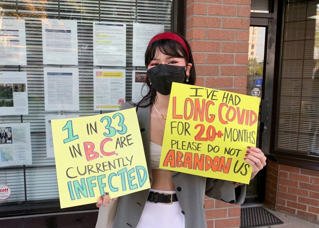 Advocates were seen raising awareness about the need for strengthening masking requirements in B.C. last August.