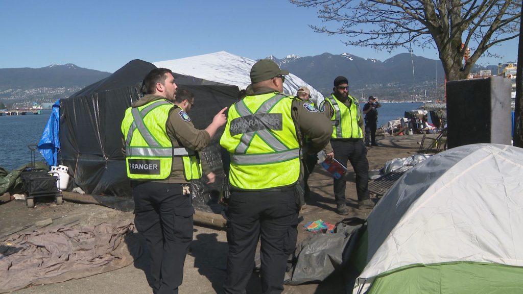 Vancouver Police Officers and Park Board Rangers notify CRAB Park users of upcoming plans for the area