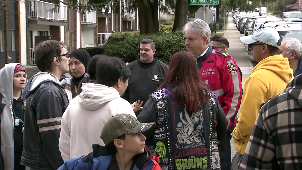 Dozens displaced by Coquitlam fire rally, angry they don't have access to their belongings