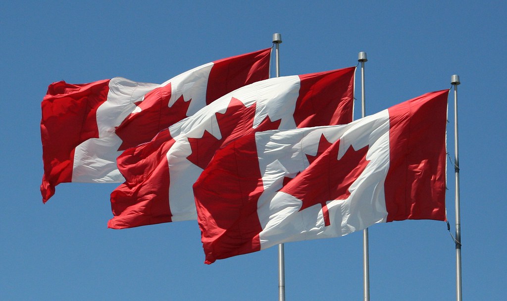 Three Canadian flags are shown in this undated image. Photo courtesy: Flickr.