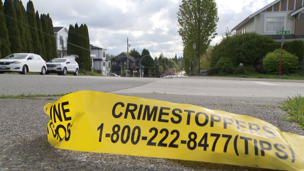 Crime scene tape is seen on a sidewalk in the area of 68 Avenue near 204 Street in Langley, B.C. on Tuesday April 30, 2024.