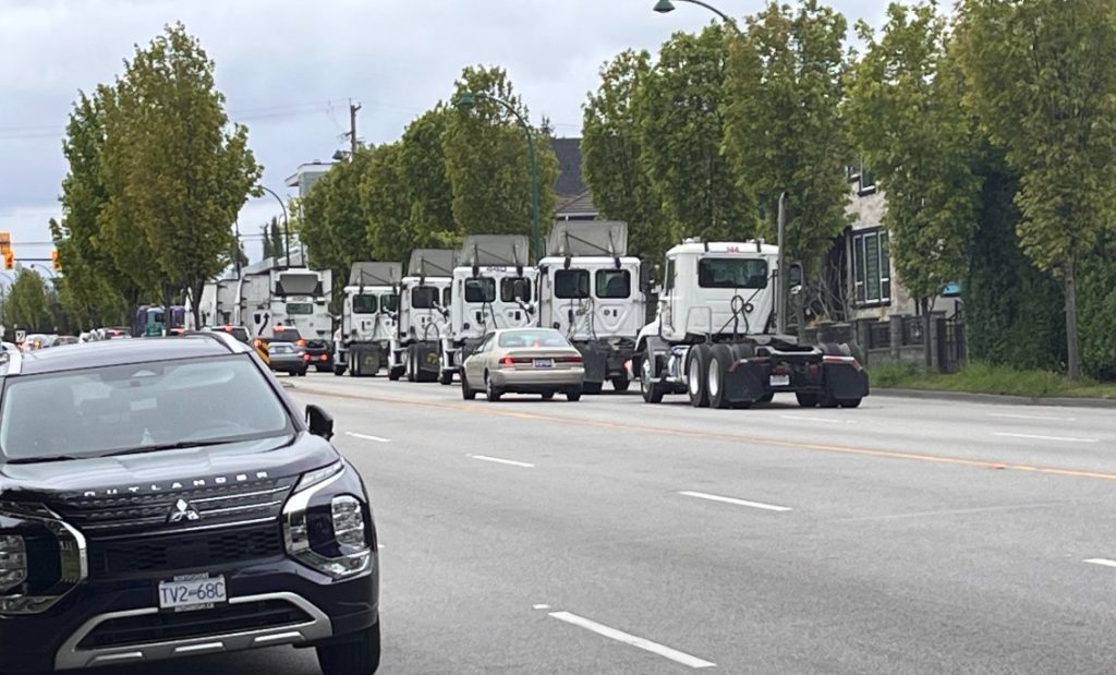 Hundreds of semi truck drivers drove across Metro Vancouver Sunday afternoon to show solidarity between company owners and drivers over proposed changes to the drayage industry.