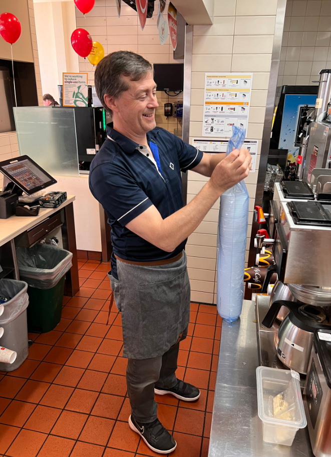 CityNews Meteorologist Michael Kuss helps set up the drink station at a McDonald's in Vancouver for McHappy Day 2024.