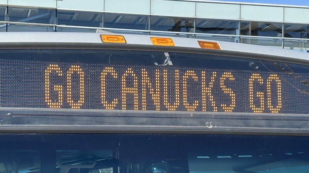 A bus in Vancouver displays 'GO CANUCKS GO' on the front to show the team support during the 2024 playoffs.