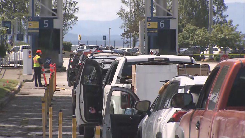 Vehicles in line to board a BC Ferries vessel