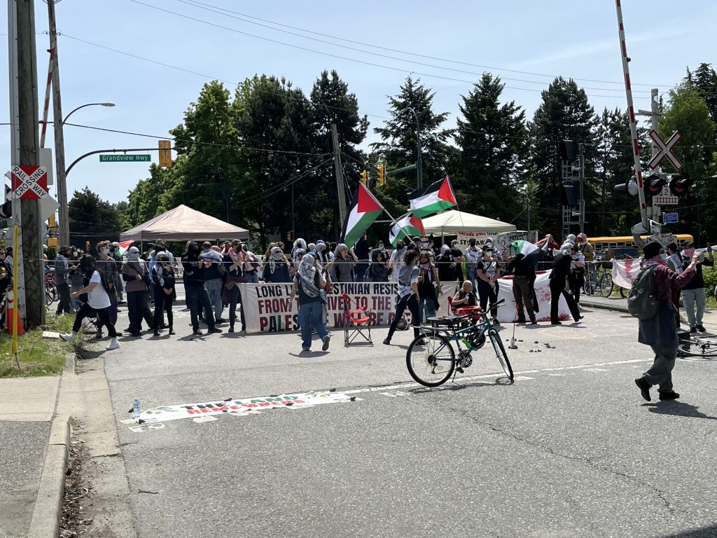 Dozens of pro-Palestinian protesters shut down an East Vancouver rail line Friday afternoon.