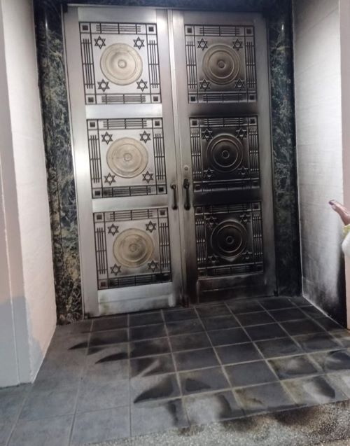 The charred door of the Schara Tzedeck synagogue.