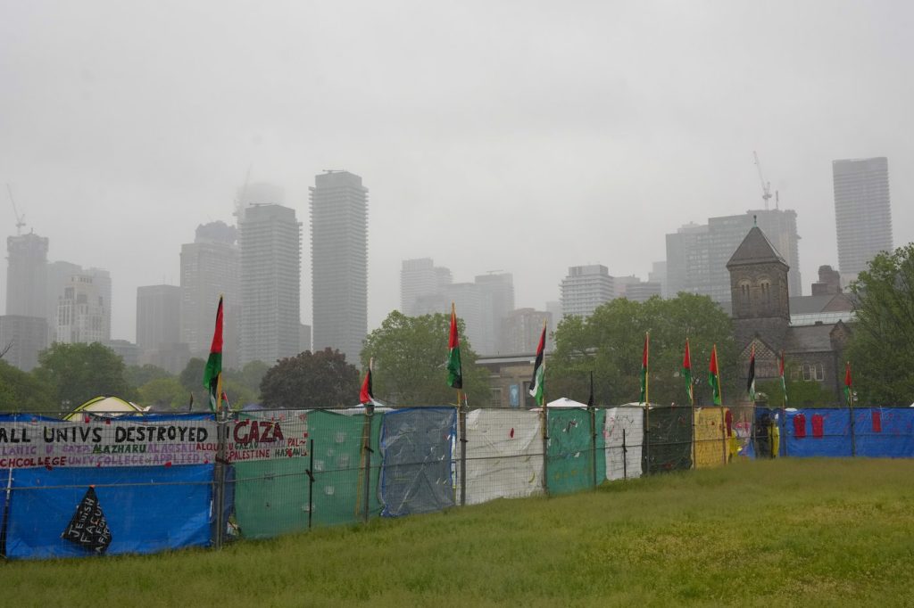 Fencing surrounds the pro-Palestinian student encampment outside Convocation Hall on the University of Toronto campus, in Toronto, Monday, May 27, 2024.