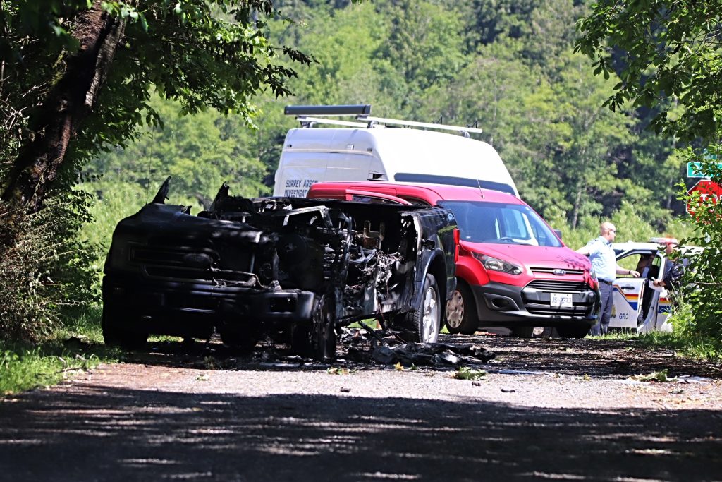Surrey Mounties attend the scene of a vehicle fire in the area of McMillan Road near 185 Street, pictured here. This came shortly after a shooting in the area of 164 Street and 10 Avenue on June 7, 2024, which left one man dead. 