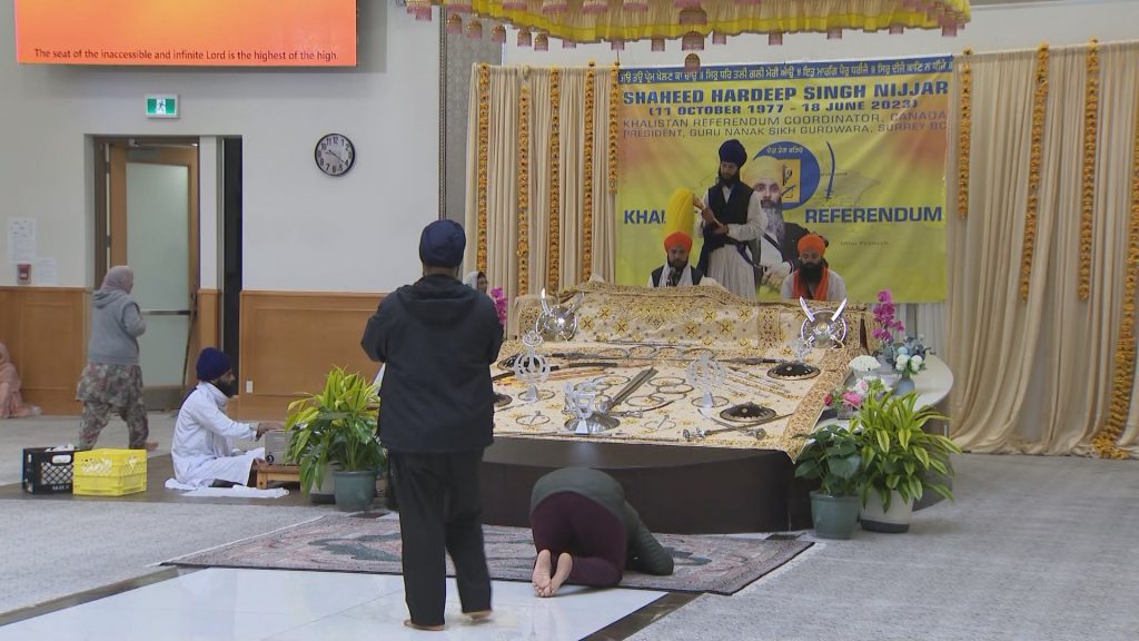 People gather at Guru Nanak Sikh Gurdwara in Surrey, B.C. on Sunday June 16, 2024.