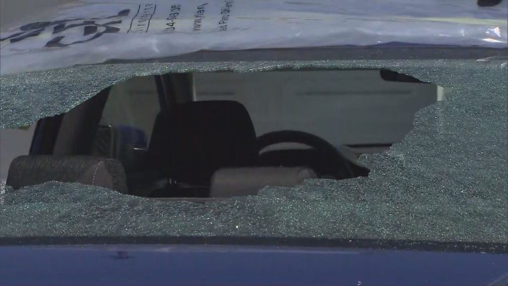 Damage is seen to the rear window of a vehicle