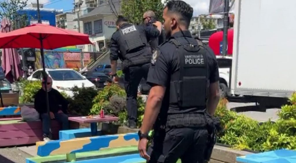 The VPD says a man has now been charged after a video of his dramatic arrest on a patio on Vancouver's Davie Street garnered attention online this week.