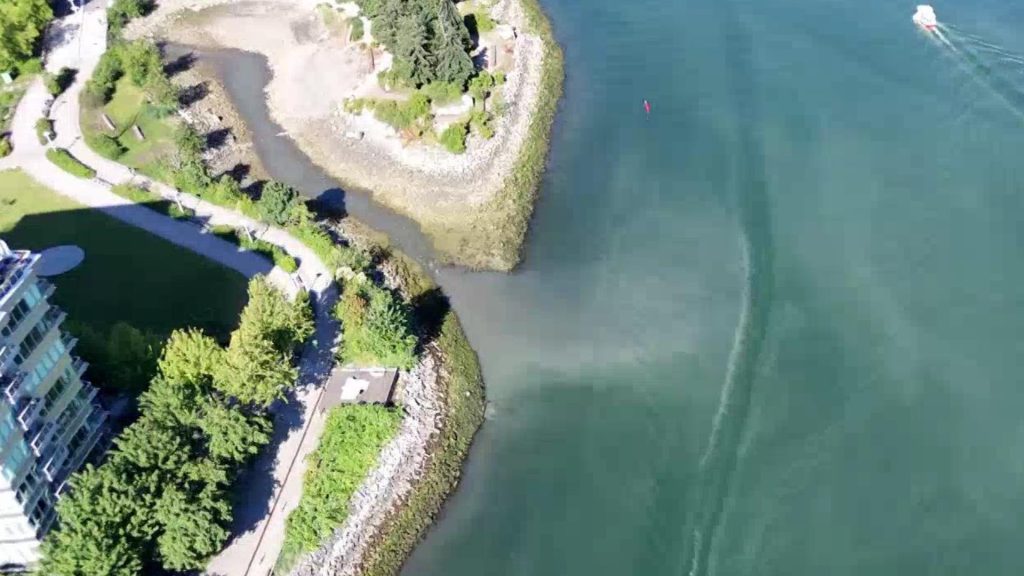 Effluent is seen in False Creek via a drone near Hinge Park in Vancouver's Olympic Village