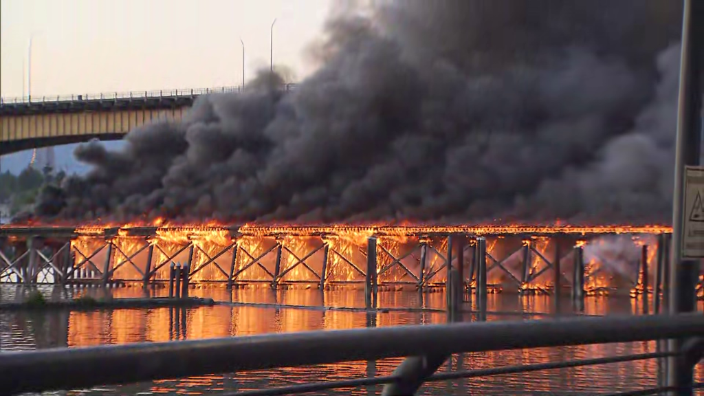 A fire on the Marpole Rail Trestle Bridge on Thursday June 21, 2024