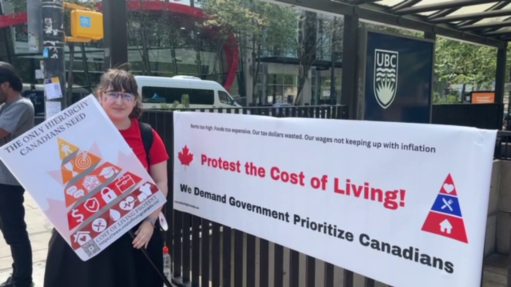 A group of people gathered at the Vancouver Art Gallery on Monday, July 1, to protest the high cost of living in Canada.