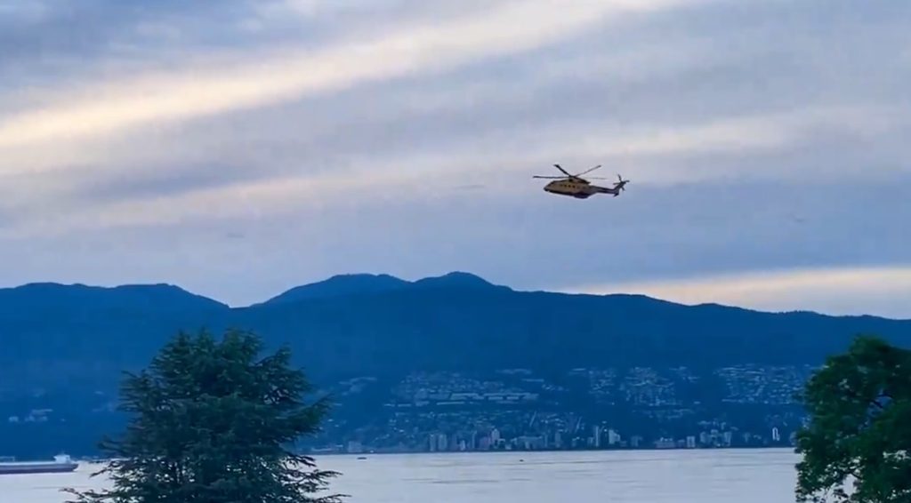 A helicopter and a hovercraft were seen circling in English Bay Friday.