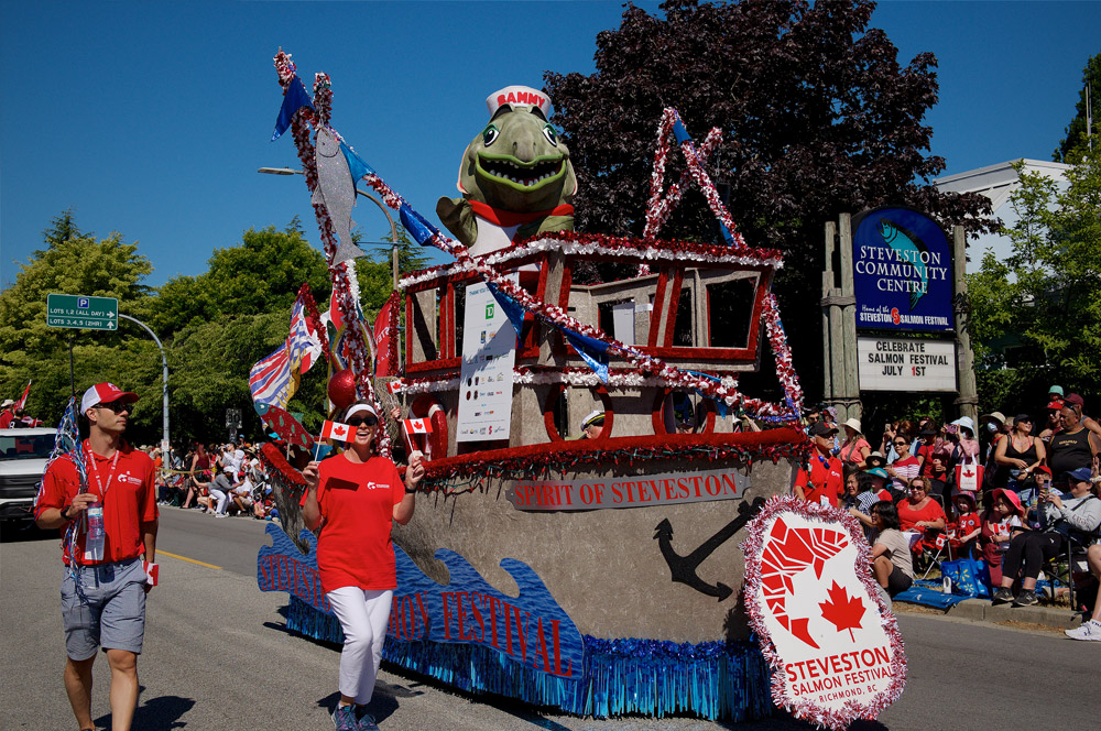 Sammy the Salmon stands on a parade float in Steveston