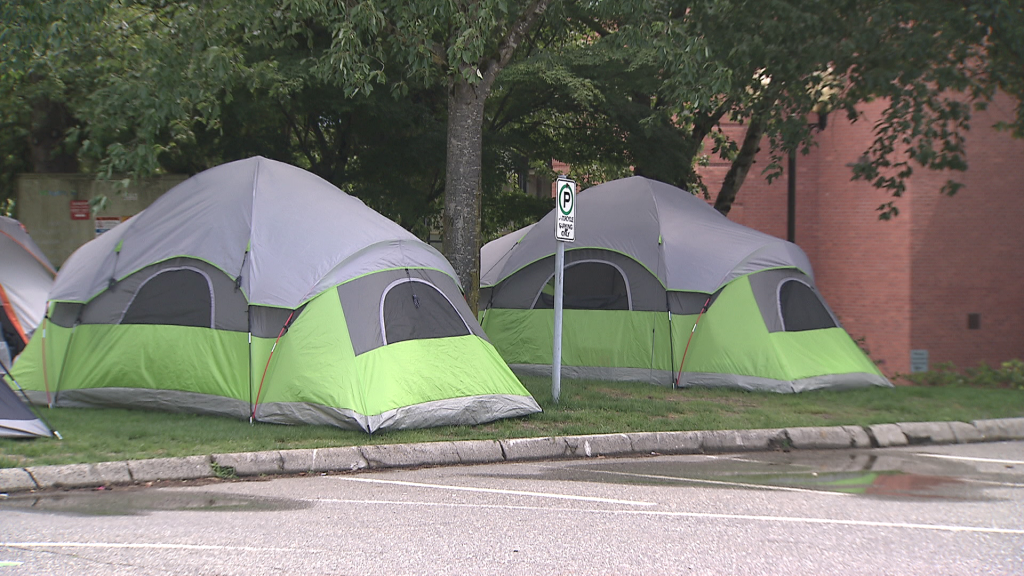 An encampment is seen outside Abbotsford City Hall on Sunday June 30, 2024