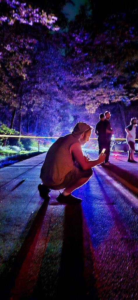 Person crouching near the scene of the crash