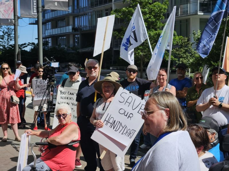 HandyDART workers protested outside of TransLink on Wednesday, July 10, 2024, calling for a new contract. This comes two weeks after unionized members voted in favour of strike action.