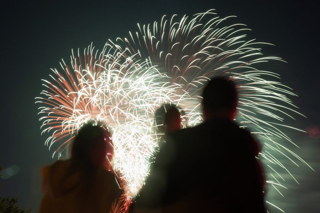 People watch as fireworks explode over LeBreton Flats area during Canada Day celebrations in downtown Ottawa, on Saturday, July 1, 2023.