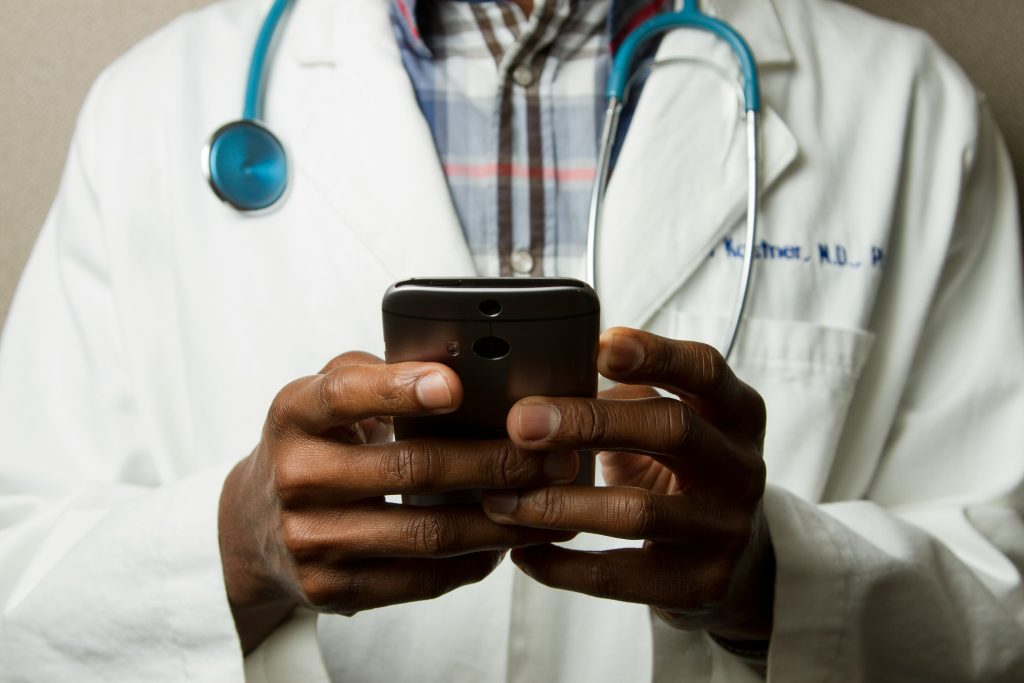 Doctor holding a smart phone