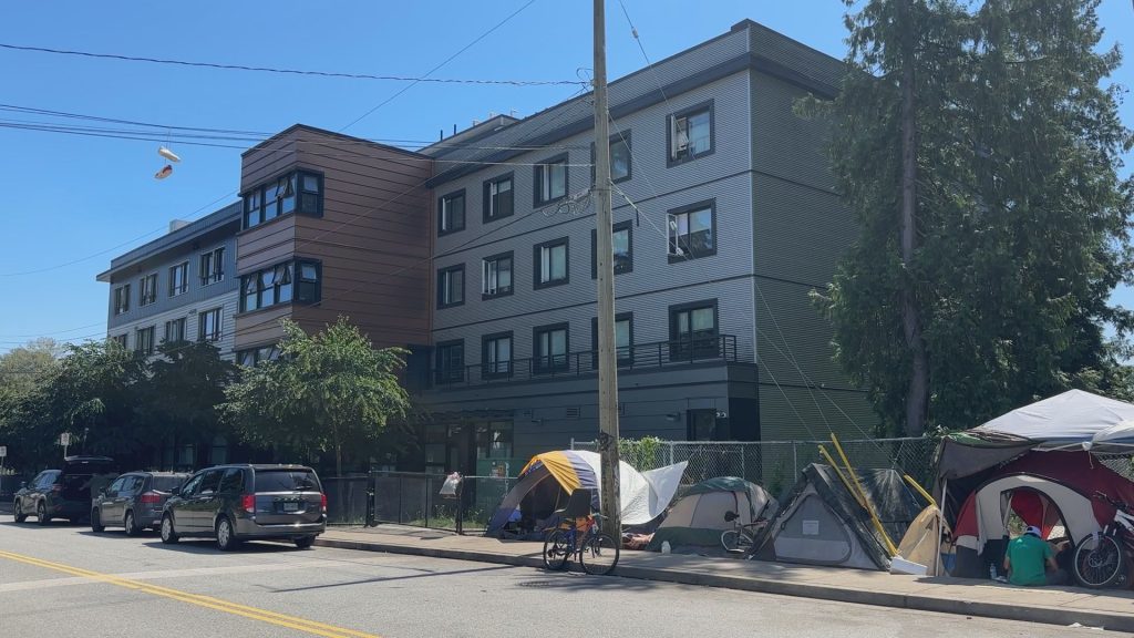 People have set up tents outside the only shelter space in the Tri-Cities due to lack of space, and the City of Coquitlam is demanding action from all levels of government to support them with more funding.