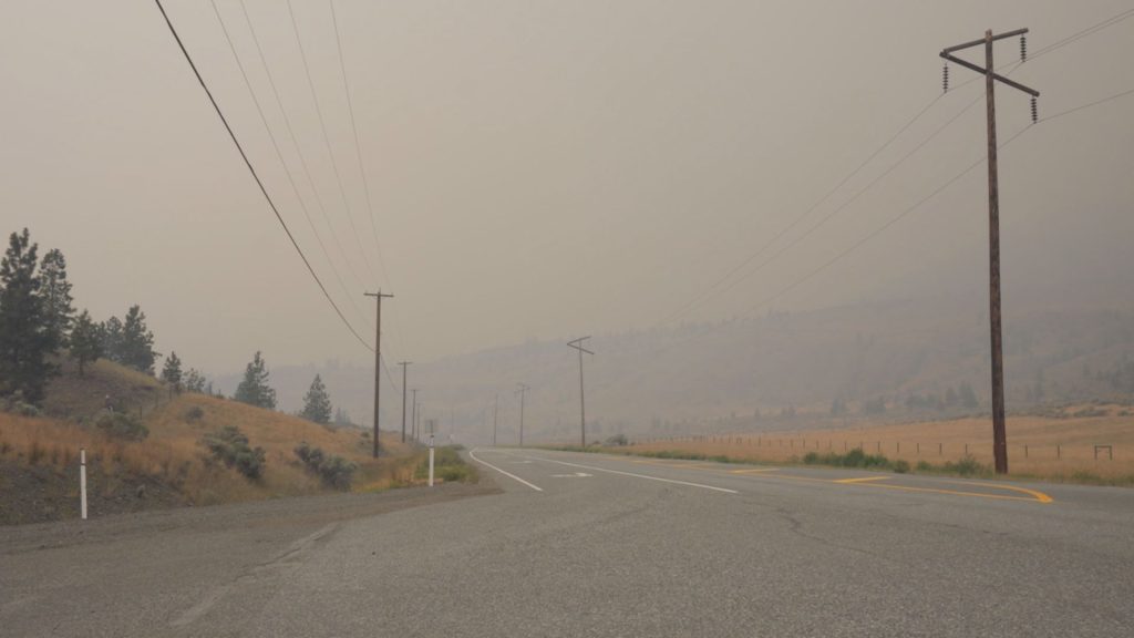 Smoke from the Shetland Creek wildfire rises next to Highway 1 near Spence Bridge