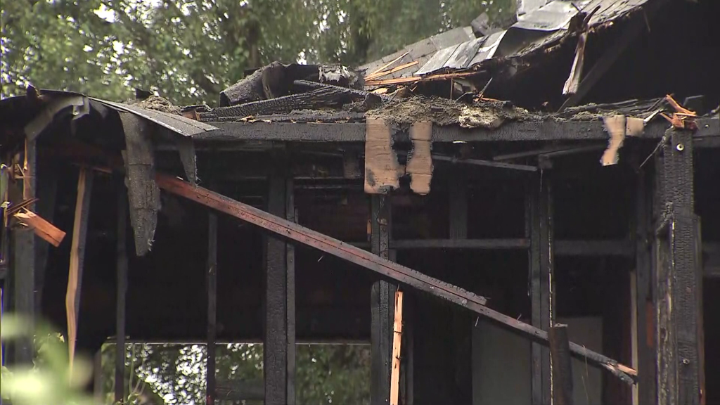 Vancouver Fire Rescue crews work on a fire on E 27th Avenue near Kaslo and Slocan