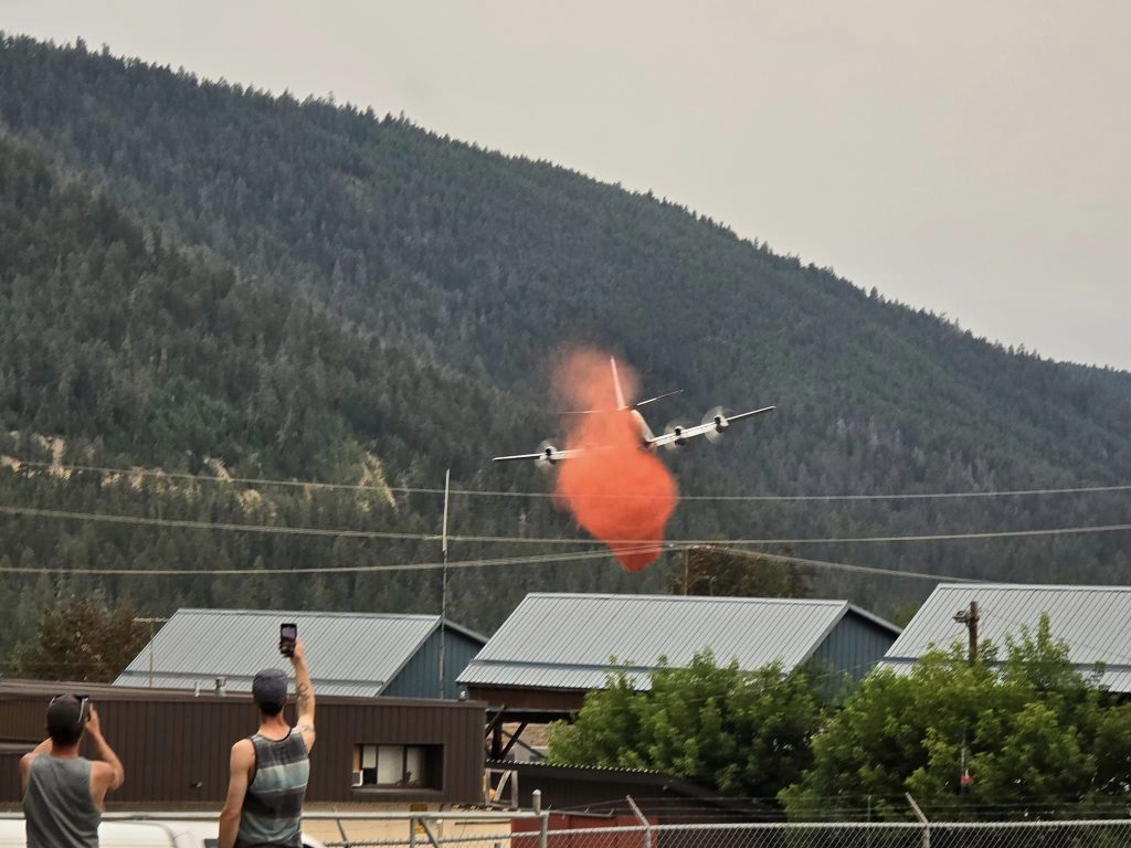 A BC Wildfire Service bomber flies over Williams Lake Sunday after a wildfire sparked in the city. (Credit: Spencer Stratton)