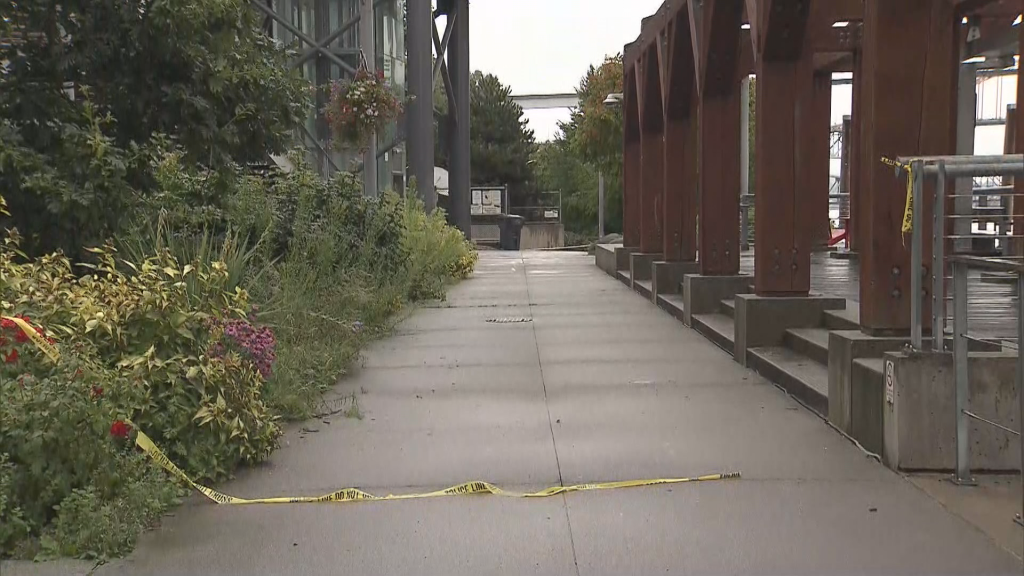 Police tape sits on the ground near the site of a stabbing in New West. (CityNews Image)