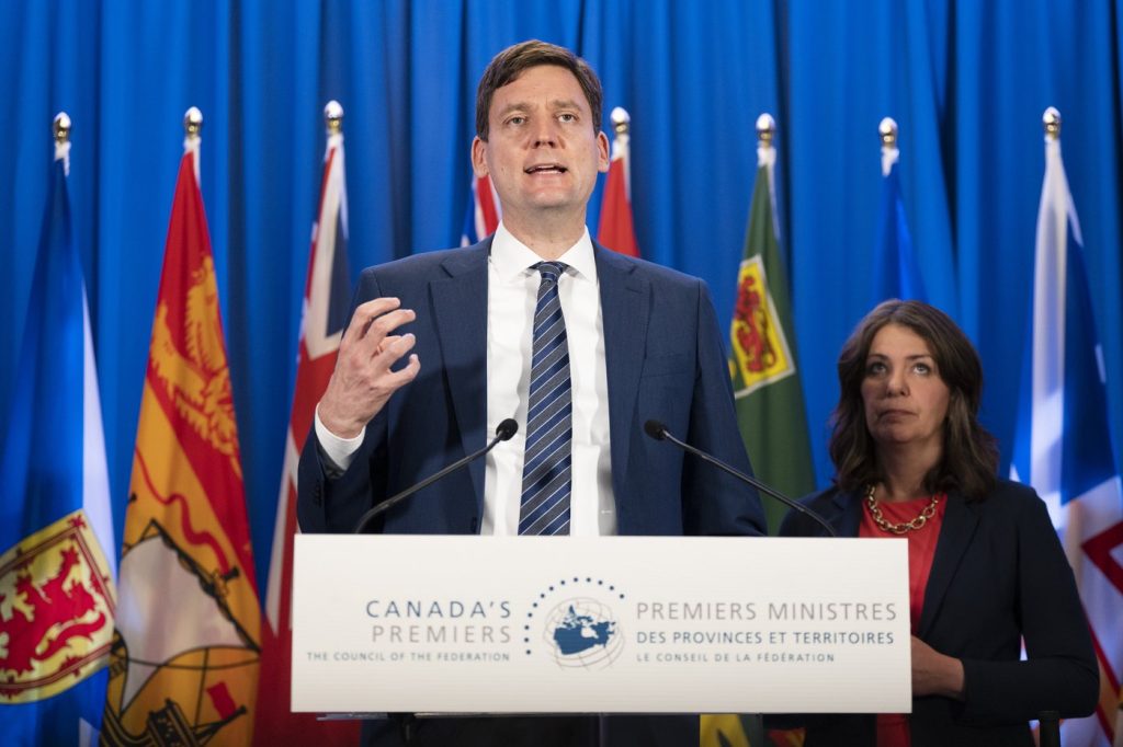 British Columbia Premier David Eby, left, speaks to reporters with Alberta Premier Danielle Smith during meetings with Canada's other premiers at the Council of the Federation in Halifax on Tuesday, July 16, 2024.