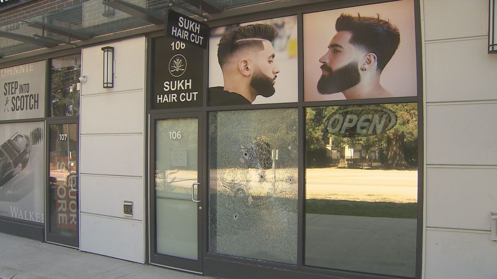 Bullet holes are seen in a vacant business.