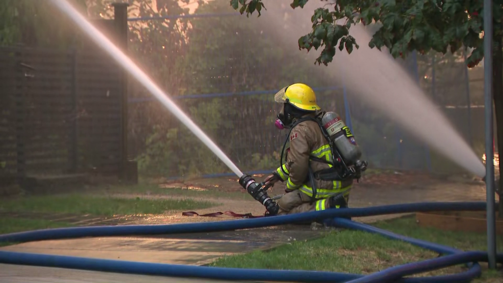 Vancouver Fire Rescue crews battle a blaze at 414 East 10th Avenue on Tuesday August 6, 2024.