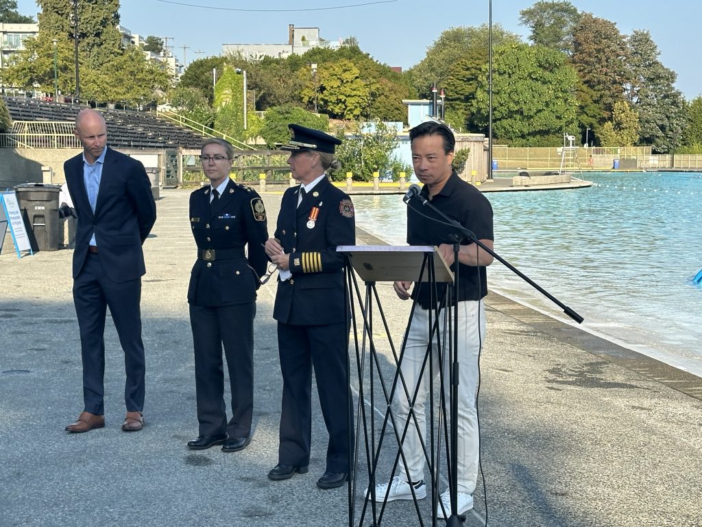 Swimmers had already taken to the water by the early Wednesday morning, getting in their laps in the newly repaired Kitsilano Pool beside Mayor Ken Sim. (CityNews Image / Mike Lloyd)