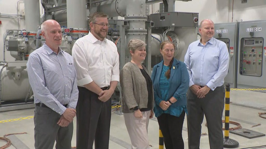 Various officials pose for a photo at BC Hydro's new Capilano substation in North Vancouver. 