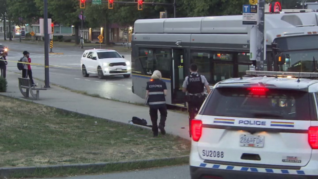 A coroner and a Surrey RCMP officer at the scene of a sudden death in the Whalley neighbourhood