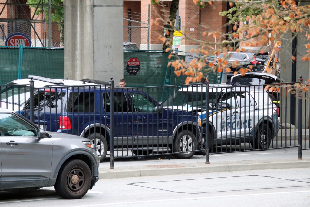 A blue SUV rammed into a police vehicle