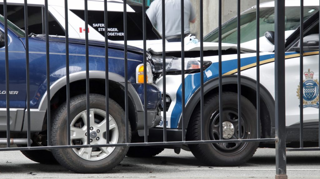 A blue SUV rammed into a police vehicle