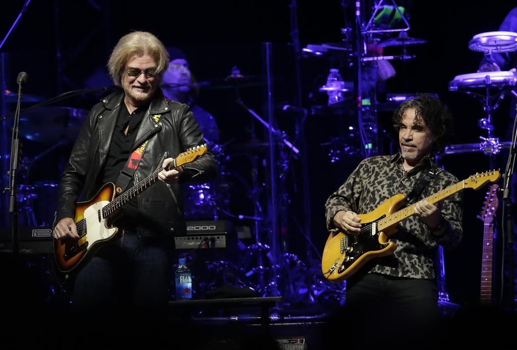 Daryl Hall, left, and John Oates perform in Glendale, Ariz. on July 17, 2017.