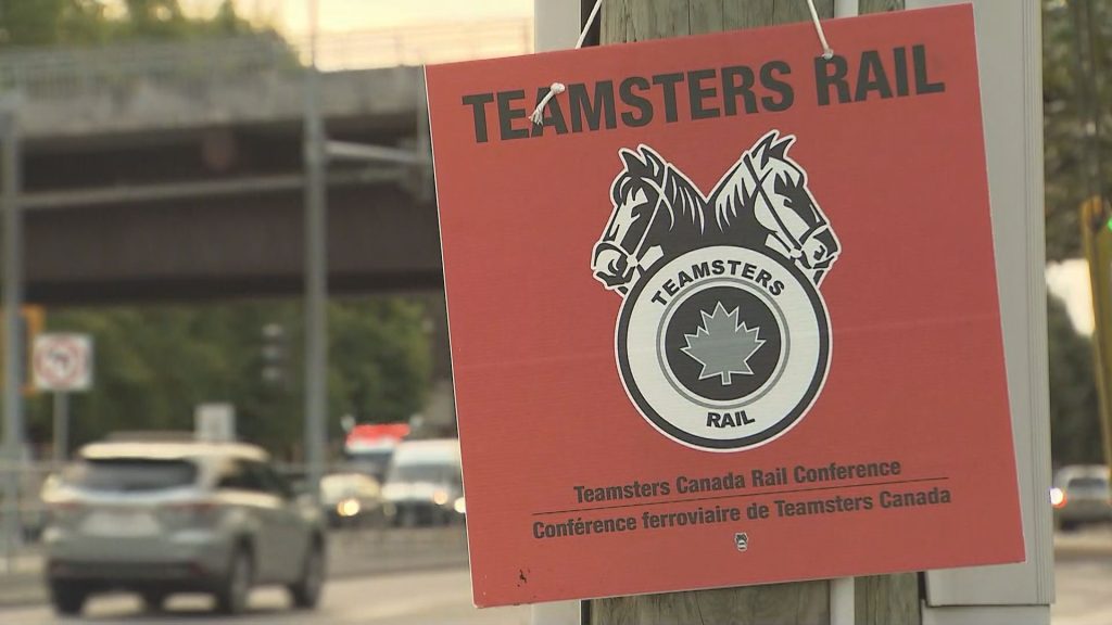 Teamsters Canada Rail Conference members in front of the Canadian Pacific Port Coquitlam Railyard on Thursday, Aug. 22, 2024.