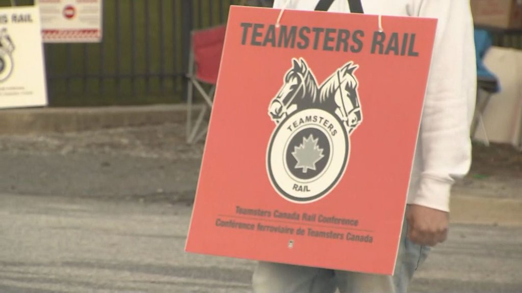 Teamsters Canada Rail Conference members in front of the Canadian Pacific Port Coquitlam Railyard on Thursday, Aug. 22, 2024.